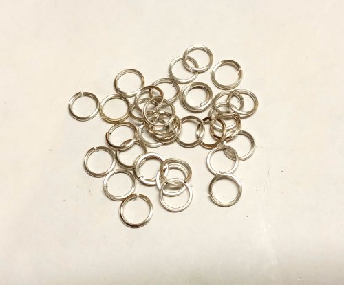 Judy Larson's Domed Stud with Drop Loop - , Metalwork, Cutting, Cutting Tool, Cutters, How To Punch Holes, Hole Punching, Punch A Hole, Stamping, Stamps, Butane Torch, Soldering, Solder, Make a coil with 20 gauge square Argentium silver wire